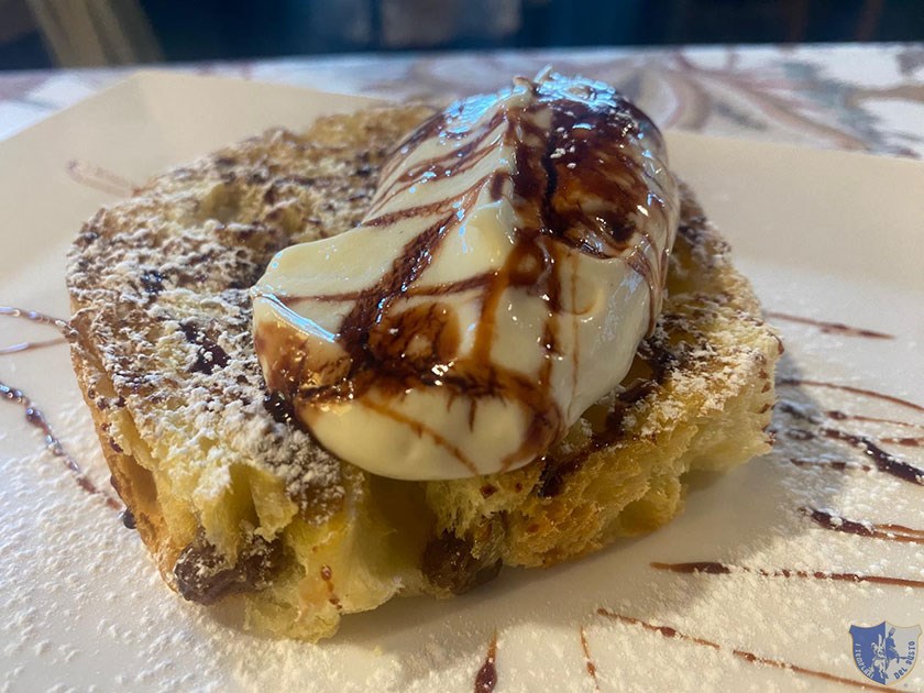 Panettone braciato con crema chatilly e riduzione di Ratafià